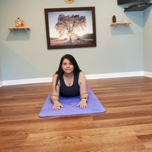 Meena laying on mat